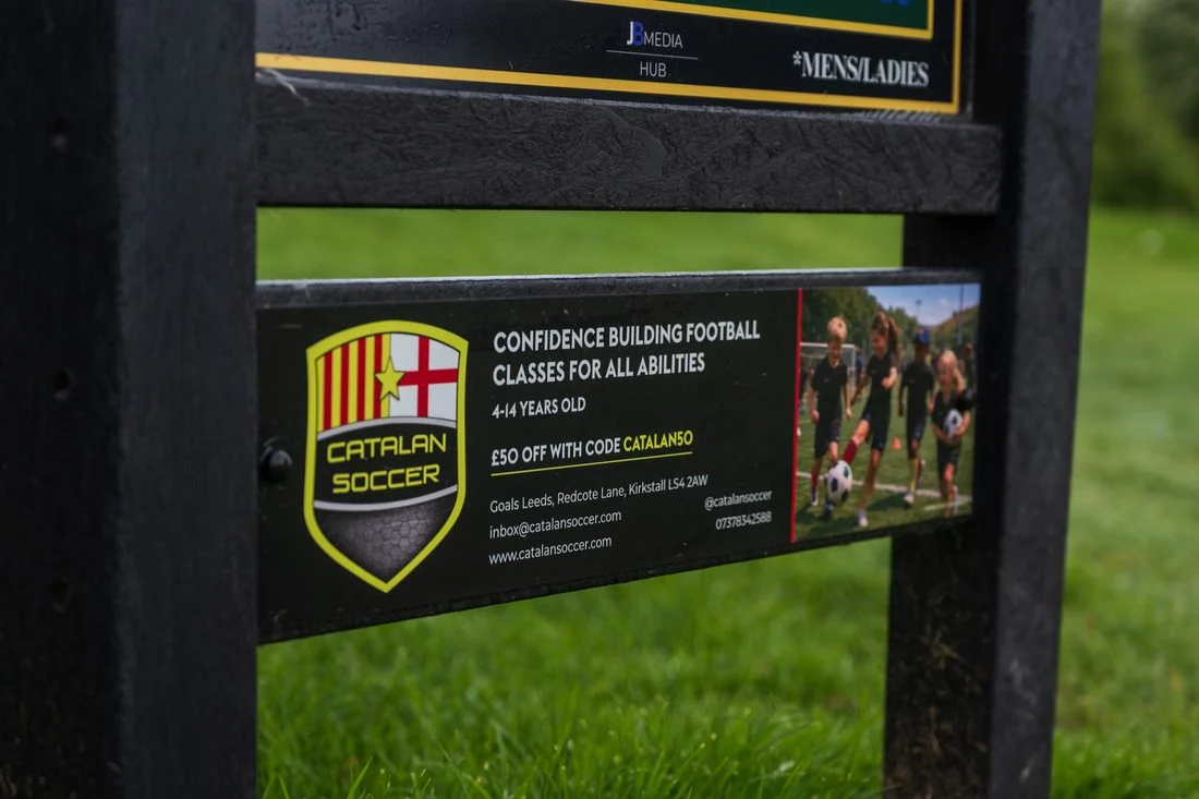 Catalan Soccer sponsor panel installed on a tee sign