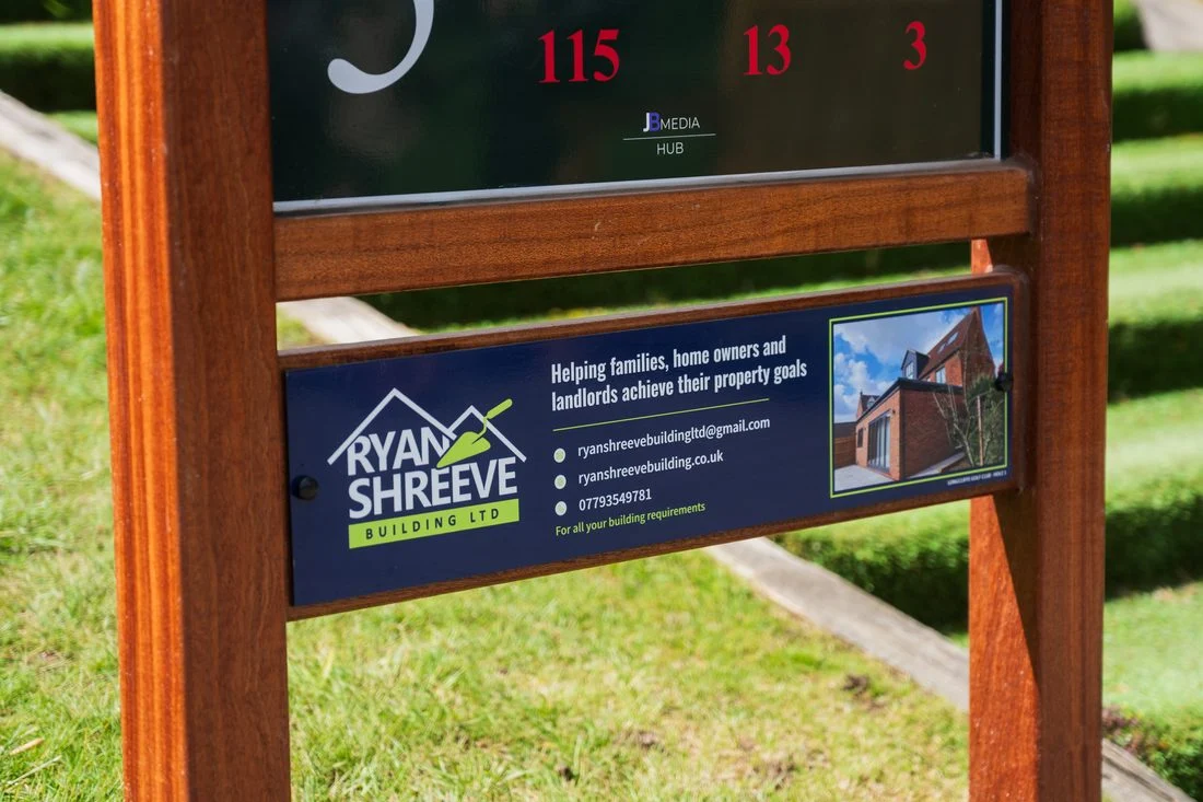 Ryan Shreeve Building sponsor panel installed on a tee sign