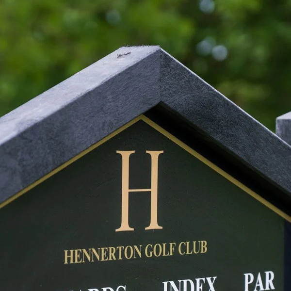 Hennerton crest on its tee sign